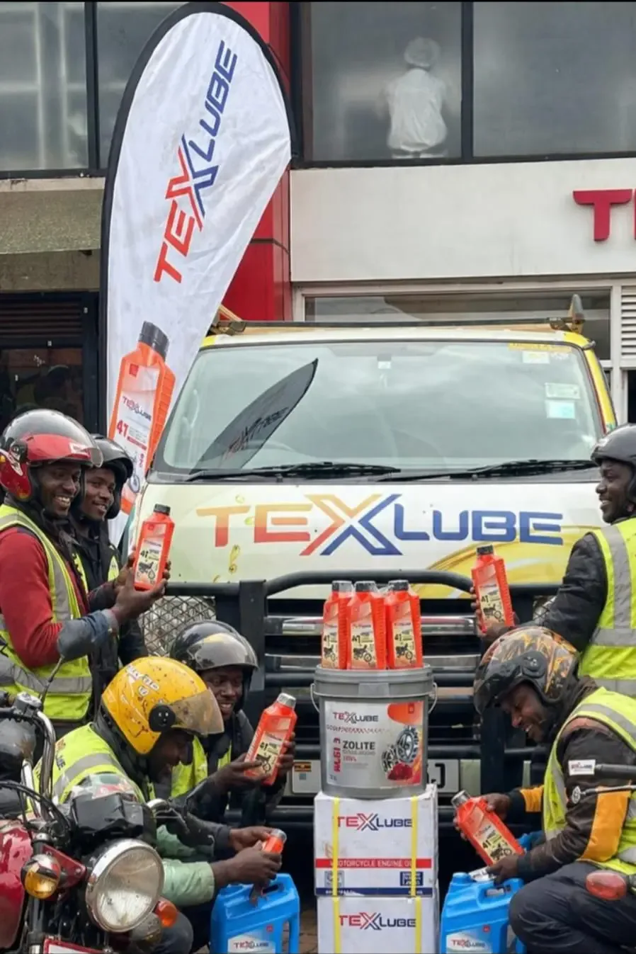 The TexLube van with the boda boda riders